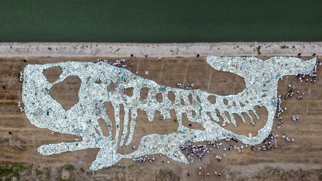 An aerial view of a 68 metre long image of a whale made by plastic waste collected from the ocean during an event to raise awareness on ocean conservation at Rudong Yangkou Harbour in Nantong in China’s eastern Jiangsu province. (STR / AFP)