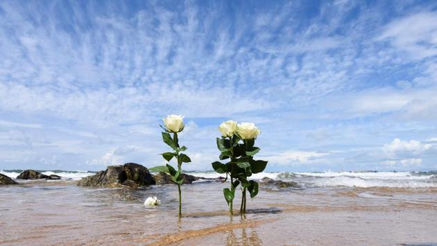 Flowers seen on a beach of Les Sables-d’Olonne after thousands of people took part in a tribute to the three rescuers who died on June 7, when a Société Nationale de Sauvetage en Mer (SNSM) vessel capsized in rough seas as a giant storm pummeled the country’s Atlantic coast. The SNSM team had been attempting to help a fishing boat which was struggling in the giant swell caused by storm Miguel. (Sebastien Salom-Gomis / AFP)
