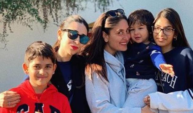 Kareena Kapoor and Krism are all smiles as they pose for a family picture in London.(Instagram)