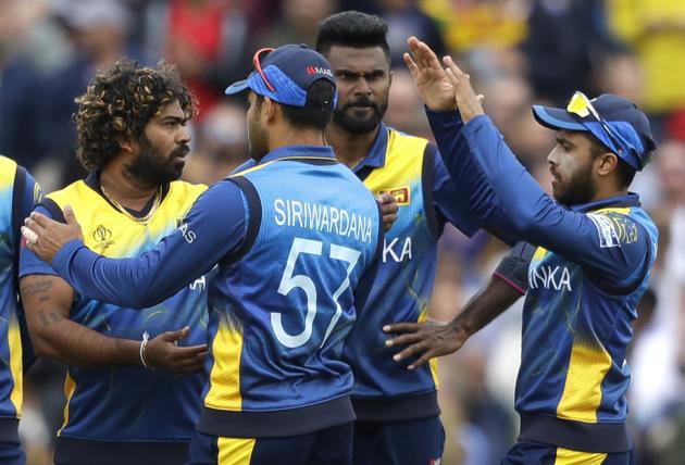 Sri Lanka's Lasith Malinga, left,celebrates taking the wicket of Australia's Steve Smith. (AP)