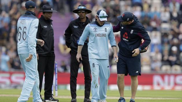 England's captain Eoin Morgan, second right, hobbles off the field of play with an injury(AP)