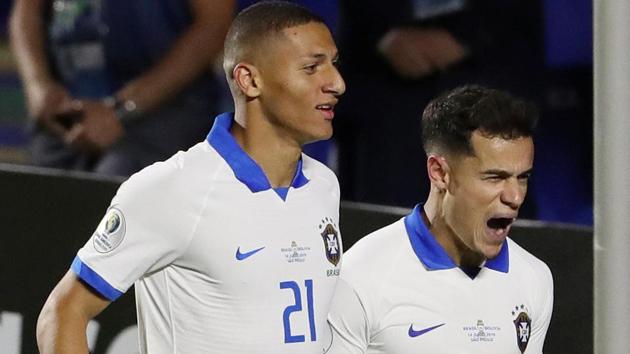 Brazil's Philippe Coutinho celebrates scoring their second goal with Richarlison(REUTERS)