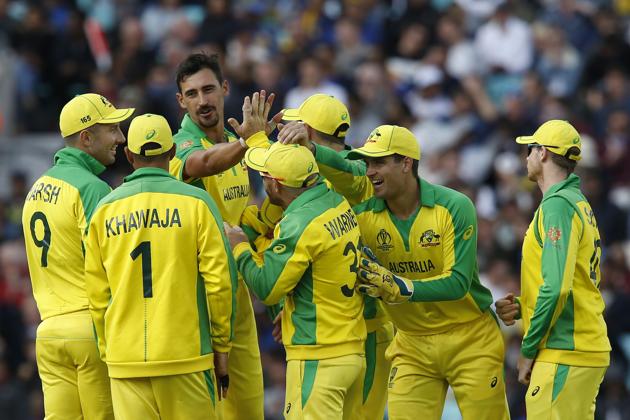 Australia's Mitchell Starc celebrates with teammates after taking the wicket of Sri Lanka's Thisara Perera. (AFP)