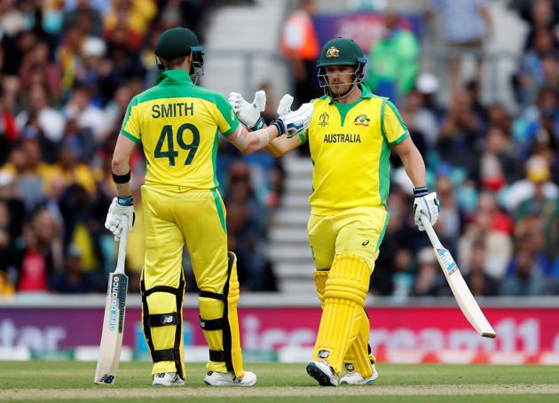 Australia's Aaron Finch celebrates his 150 with Steve Smith Action. (Action Images via Reuters)