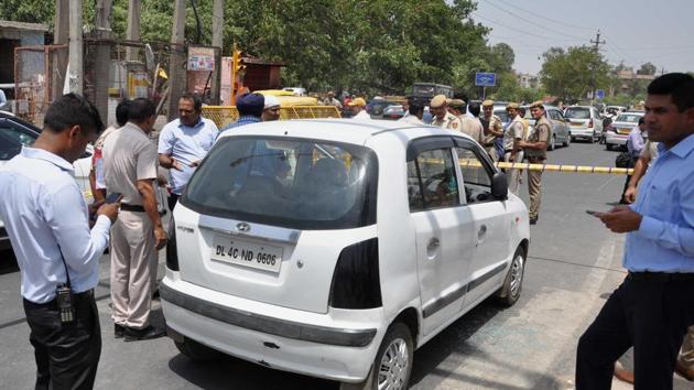 Police officers investigate the spot of a shootout in a car where two persons were killed, at Mandoli Chowk, Nandnagri in New Delhi, India on Friday, June 14, 2019. (HT photo) Police officers investigate the spot of a shootout in a car where two persons were killed, at Mandoli Chowk, Nandnagri in New Delhi, India on Friday, June 14, 2019. (HT photo)