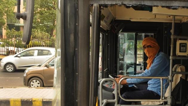 Bus drivers and conductors said working in the heat is particularly tough for them as the buses, made of fibre, get too hot. “It almost feels as if you are in a bus that has caught fire,” a conductor said, adding the fans circulate hot air and provide little respite. He said they frequently fall sick as a result. (Parveen Kumar / HT Photo)