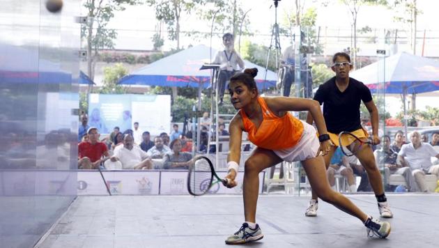 Sunayna Kuruvilla (orange) won the semi-final match during the National Squash Championship at Amanora Mall in Pune.(Rahul Raut/HT PHOTO)