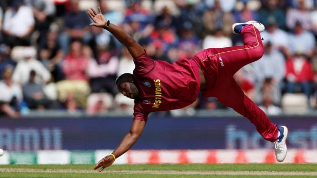 West Indies Andre Russell dives for the ball.(Reuters)