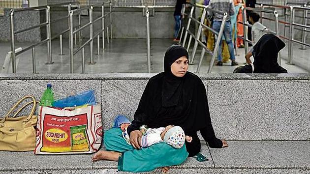 A woman waits with a baby outside the OPD counters at Lok Nayak Hospital in New Delhi on Monday. Doctors in Delhi NCR, following a nationwide call by the IMA, went on strike to condemn a violent attack on junior doctors in West Bengal. (Sanchit Khanna/HT PHOTO) A woman waits with a baby outside the OPD counters at Lok Nayak Hospital in New Delhi on Monday. Doctors in Delhi NCR, following a nationwide call by the IMA, went on strike to condemn a violent attack on junior doctors in West Bengal. (Sanchit Khanna/HT PHOTO)