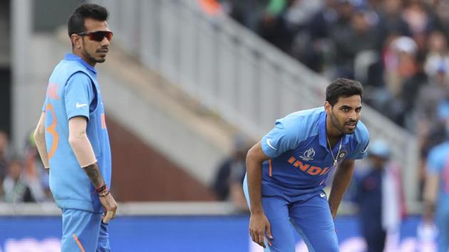 India's Bhuvneshwar Kumar, right, bends in pain after bowling a delivery during the Cricket World Cup match between India and Pakistan at Old Trafford in Manchester, England, Sunday, June 16, 2019. (AP Photo/Aijaz Rahi) (AP) India's Bhuvneshwar Kumar, right, bends in pain after bowling a delivery during the Cricket World Cup match between India and Pakistan at Old Trafford in Manchester, England, Sunday, June 16, 2019. (AP Photo/Aijaz Rahi) (AP)