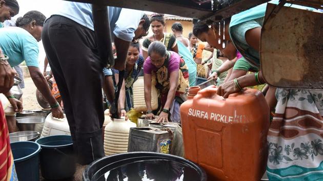 Over the next two hours Dukre helps them empty the 12,000-litre tank, providing a lifeline to this small community as India reels from one of its worst droughts in years. “We are working overtime,” said 41-year-old Dukre, who conducts four rounds of deliveries a day to hamlets around Shahapur in the parched state of Maharashtra. (Punit Paranjpe / AFP)