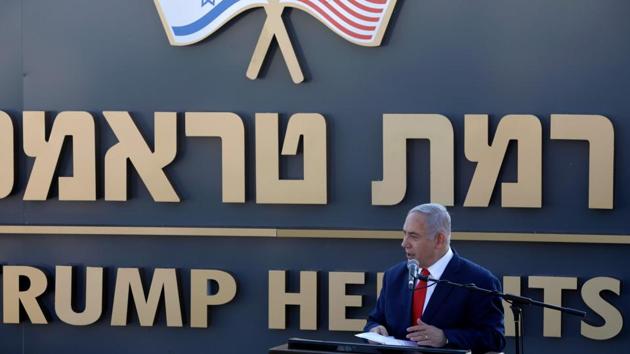 Israeli Prime Minister Benjamin Netanyahu gives a speech before the newly-unveiled sign for the new settlement of "Ramat Trump", or "Trump Heights" in English, named after the incumbent US President during an official ceremony in the Israeli-annexed Golan Heights on June 16, 2019.(AFP)