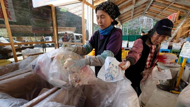 Workers sort plastic waste Kamikatsu. The remainder, like most waste in Japan, is incinerated, as the country’s mountainous terrain considered unsuitable for landfills. The nation produces less general waste per person than most developed countries, but it generates more plastic waste per capita than anywhere except the United States. (Kazuhiro Nogi / AFP) 