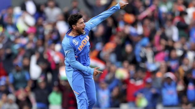 India's Kuldeep Yadav leaps in the air to celebrate the dismissal of Pakistan's Babar Azam. (AP)