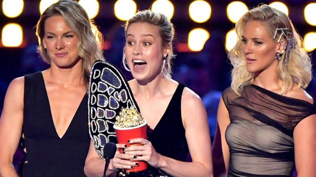 Brie Larson and stunt doubles (L-R) Ingrid Kleinig and Joanna Bennett accept the Best Fight award for Captain Marvel onstage during the 2019 MTV Movie and TV Awards.(AFP)