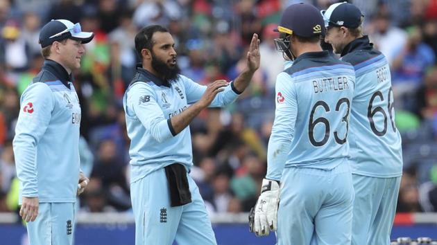 England's Adil Rashid, second left, celebrates with teammates the dismissal of Afghanistan's Asghar Afghan. (AP)