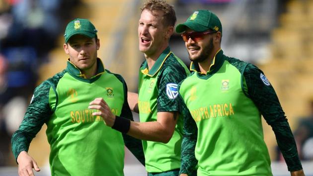 South Africa's Chris Morris (C) celebrates with teammates after the dismissal of Afghanistan's Ikram Ali Khil.(AFP)