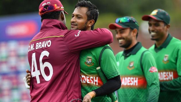 Bangladesh's Shakib Al Hasan (2L) hugs West Indies' Darren Bravo (L) as he walks off the pitch after winning the 2019 Cricket World Cup group stage match between West Indies and Bangladesh(AFP)