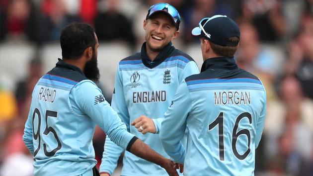 England's Adil Rashid celebrates with Joe Root and Eoin Morgan after taking the wicket of Afghanistan's Asghar Afghan. (Action Images via Reuters)