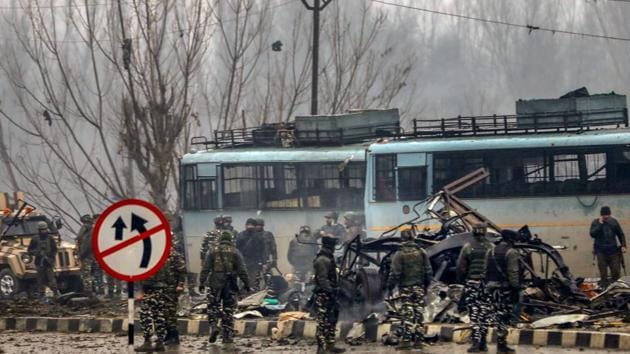 Security personnel carry during rescue and relief works at the site of suicide bomb attack at Lathepora Awantipora in Pulwama district of south Kashmir, Thursday, February 14, 2019.(PTI Photo)