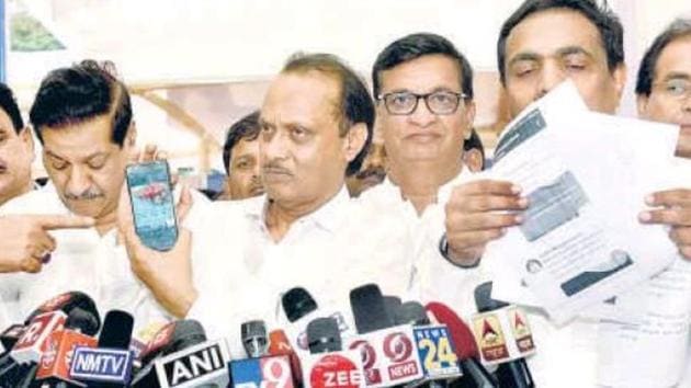(From left) Congress’ Prithviraj Chavan, NCP’s Ajit Pawar with Congress leader Balasaheb Thorat and NCP leader Jayant Patil showing the tweets on the Maharashtra budget.(ANSHUMAN POYREKAR/HT PHOTO)