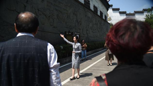 Visitors look on at a guide during a tour of the Luzhou Laojiao distillery where baijiu is produced in Luzhou, China. “I worked on a cattle farm in Australia and this kind of aftertaste reminds me of the smell of ... cow manure, hay, and horses,” she said, in the London bar Demon, Wise & Partners. “It’s not the beverage for me,” Veale conceded. (Hector Retamal / AFP) Visitors look on at a guide during a tour of the Luzhou Laojiao distillery where baijiu is produced in Luzhou, China. “I worked on a cattle farm in Australia and this kind of aftertaste reminds me of the smell of ... cow manure, hay, and horses,” she said, in the London bar Demon, Wise & Partners. “It’s not the beverage for me,” Veale conceded. (Hector Retamal / AFP)
