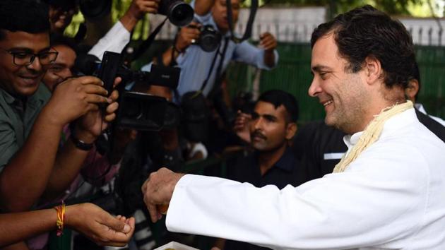 Congress President Rahul Gandhi offering sweets to media person on his 49th birthday at party office in New Delhi . (ANI Photo) Congress President Rahul Gandhi offering sweets to media person on his 49th birthday at party office in New Delhi . (ANI Photo)