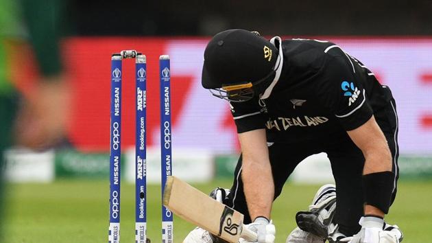 New Zealand's Martin Guptill looks at the stumps after kncoking the bails off and losing his own wicket for 35 runs during the 2019 Cricket World Cup group stage match between New Zealand and South Africa at Edgbaston in Birmingham(AFP)