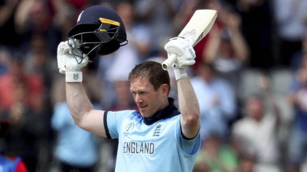 Manchester: England's captain Eoin Morgan raises his bat and helmet to celebrate scoring a century during the Cricket World Cup match between England and Afghanistan at Old Trafford in Manchester, England, Tuesday, June 18, 2019.AP/PTI(AP6_18_2019_000169B)(AP)