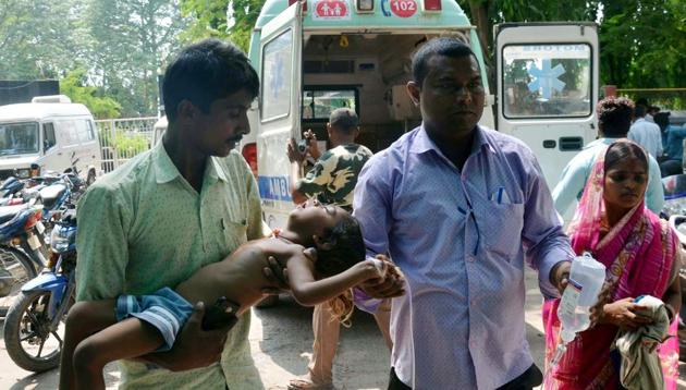 Family members bring their child to the hospital on the symptoms of Acute Encephalitis Syndrome (AES) in Muzaffarpur on June 19, 2019. (ANI Photo)