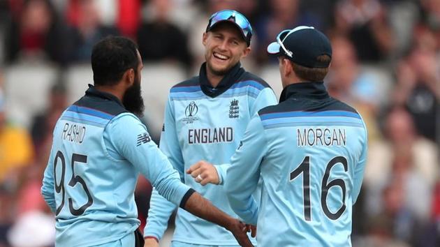 ICC Cricket World Cup - England v Afghanistan - Old Trafford, Manchester, Britain - June 18, 2019 England's Adil Rashid celebrates with Joe Root and Eoin Morgan after taking the wicket of Afghanistan's Asghar Afghan(Action Images via Reuters)