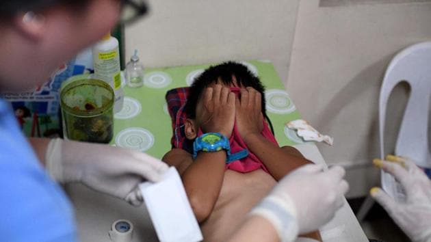 A boy writhing in pain during a mass circumcision at a village health centre in Manila. Many get local anaesthetics but for some the sensation is still intense. They are also provided with antibiotics to protect against any infections. Around 90% of males are circumcised for non-religious reasons in the Philippines, according to World Health Organization data. (Noel Celis / AFP)