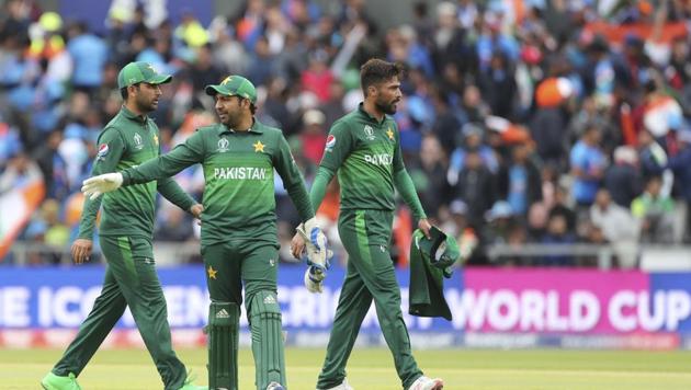 Pakistan's captain Sarfaraz Ahmed, center, and teammates leave at the end of India's innings during the Cricket World Cup match between India and Pakistan at Old Trafford in Manchester, England, Sunday, June 16, 2019(AP)