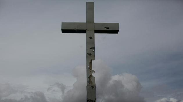 A vandalised cross is located on a main avenue at the home town of Maroly Bastardo. Anguished, Carolina clings to hope that perhaps a lesser tragedy has befallen her daughter and grandchildren. She prays smugglers are holding them hostage to extract more money, and that any day now she will get the ransom call. “My heart tells me they are alive,” Carolina said. “But it’s a torture.” (Ivan Alvarado / REUTERS) A vandalised cross is located on a main avenue at the home town of Maroly Bastardo. Anguished, Carolina clings to hope that perhaps a lesser tragedy has befallen her daughter and grandchildren. She prays smugglers are holding them hostage to extract more money, and that any day now she will get the ransom call. “My heart tells me they are alive,” Carolina said. “But it’s a torture.” (Ivan Alvarado / REUTERS)