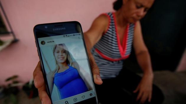 Carolina Gil shows a picture of her daughter Maroly Bastardo. Carolina, begged her to stay. Neither Bastardo nor her children could swim. Barely three weeks earlier, 27 people had gone missing after a migrant boat went down in the narrow stretch of water separating Venezuela from Trinidad. The 20-kilometer strait, known for its treacherous currents, is nicknamed the Dragon’s Mouths. (Ivan Alvarado / REUTERS) Carolina Gil shows a picture of her daughter Maroly Bastardo. Carolina, begged her to stay. Neither Bastardo nor her children could swim. Barely three weeks earlier, 27 people had gone missing after a migrant boat went down in the narrow stretch of water separating Venezuela from Trinidad. The 20-kilometer strait, known for its treacherous currents, is nicknamed the Dragon’s Mouths. (Ivan Alvarado / REUTERS)