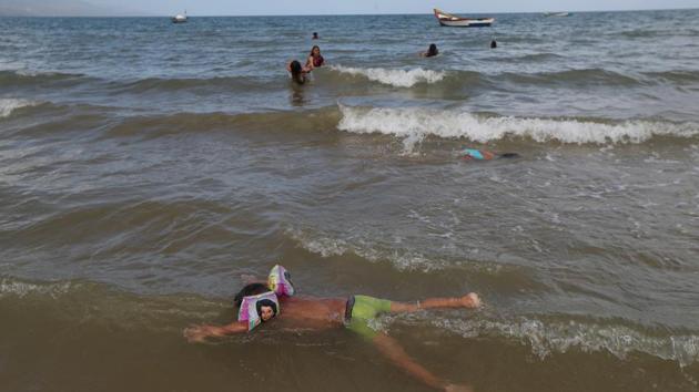 Children play on the shore of ‘La Salina’ area. Abreu was identified as the man in the photos by relatives of people on the Ana. Venezuela’s Civil Protection agency confirmed he had been rescued. They said the man left the hospital without “authorisation.” Venezuelan authorities barely searched for the Ana Maria. Trinidad’s coast guard conducted its own search, but spotted no signs of the Ana Maria or its passengers. (Ivan Alvarado / REUTERS) Children play on the shore of ‘La Salina’ area. Abreu was identified as the man in the photos by relatives of people on the Ana. Venezuela’s Civil Protection agency confirmed he had been rescued. They said the man left the hospital without “authorisation.” Venezuelan authorities barely searched for the Ana Maria. Trinidad’s coast guard conducted its own search, but spotted no signs of the Ana Maria or its passengers. (Ivan Alvarado / REUTERS)