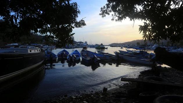 Boats are docked at Alcan Bay, in Trinidad and Tobago. Since 2016, almost 25,000 Venezuelans have arrived in Trinidad, according to government figures, many without documentation. Traffickers have been known to abandon their human cargo in rough waters and force female and child passengers into prostitution. A shortage of spare parts in Venezuela means boats often take to sea in disrepair. (Andrea De Silva / REUTERS) Boats are docked at Alcan Bay, in Trinidad and Tobago. Since 2016, almost 25,000 Venezuelans have arrived in Trinidad, according to government figures, many without documentation. Traffickers have been known to abandon their human cargo in rough waters and force female and child passengers into prostitution. A shortage of spare parts in Venezuela means boats often take to sea in disrepair. (Andrea De Silva / REUTERS)