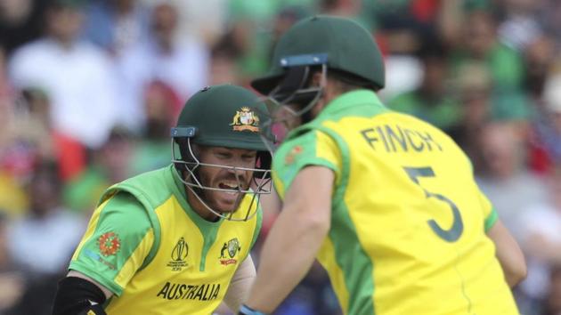 Australia's David Warner, left, and Australia's captain Aaron Finch run between wickets.(AP)