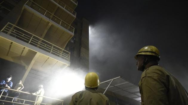 A fire broke out at a 10-storeyed residential building in Delhi’s Pitampura, a Delhi Fire Service official said Thursday. About 100 residents were safely rescued and no one was injured in the fire which broke out on a fifth-floor apartment around 1 am and spread further. Fifteen fire tenders took nearly three hours to extinguish the flames. The exact cause of the fire was yet to be ascertained. (Burhaan Kinu / HT File / Representative)