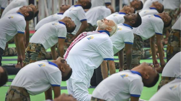 Prime Minister Narendra Modi on Friday led at least 30,000 people in a mass session of exercise and meditation in Jharkhand’s capital Ranchi as millions across the country stretched and bend on the fifth edition of International Yoga Day. The Prime Minister has been tweeting videos of various asanas since early June urging people to gear up for the International Yoga Day, which is being celebrated on a global scale since 2015. (Kamal Kishore / PTI)