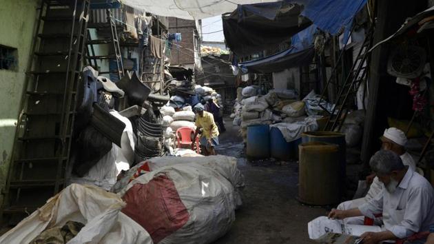Sacks of plastic waste arranged outside a factory in Dharavi. The area defies most Western notions of a slum; Dharavi is a hive of economic activity and boasts an estimated annual turnover of more than a billion dollars. Industries include pottery, leather and textiles -- about 5,000 businesses operate from around 15,000 one-room workshops, according to estimates. Masses of rubbish are also separated there for recycling. (Punit Paranjpe / AFP)
