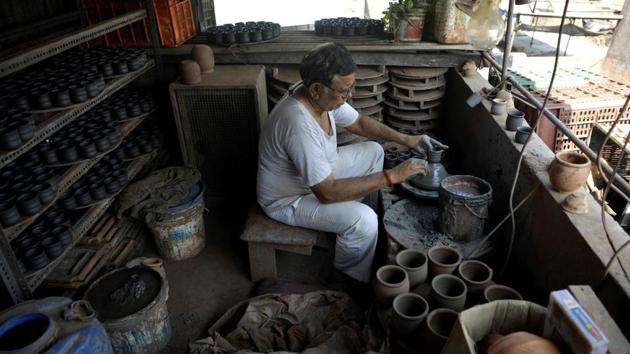 A potter works in his house in Dharavi. “We have been living and working here for over 100 years... You’ll have to shoot us before building your towers here,” says potter Mepa Gudiya, who exports earthenware across India and abroad. “Lives will be enhanced without destroying their social fabric. It can be a model for the world,” Shah told AFP in a telephone interview from Dubai. (Punit Paranjpe / AFP)