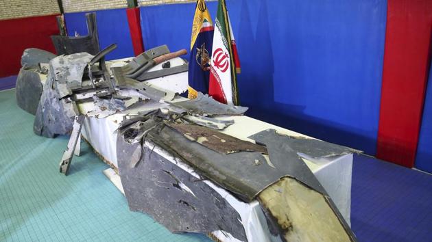Debris from what Iran's Revolutionary Guard aerospace division describes as the U.S. drone which was shot down on Thursday is displayed in Tehran, Iran. On Friday, the head of Iran’s Revolutionary Guard’s aerospace division told Iranian state television that Iran had given repeated warnings before launching a missile at the U.S. military surveillance drone. (AP) Debris from what Iran's Revolutionary Guard aerospace division describes as the U.S. drone which was shot down on Thursday is displayed in Tehran, Iran. On Friday, the head of Iran’s Revolutionary Guard’s aerospace division told Iranian state television that Iran had given repeated warnings before launching a missile at the U.S. military surveillance drone. (AP)