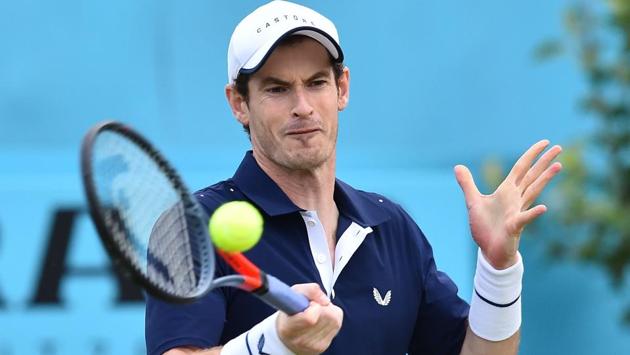 Britain's Andy Murray returns to Colombia's Juan Sebastian Cabal and Robert Farah.(AFP)