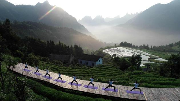 Yoga enthusiasts practice in the mountain village of Qiqi in Zhangjiajie, China’s central Hunan Province ahead of International Yoga Day. (AFP)