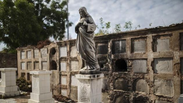 Pillaged vaults stand inside Cuadrado cemetery in Maracaibo, Venezuela. Thieves have broken into some of the vaults and coffins since late last year, stealing ornaments and sometimes items from corpses as the country sinks to new depths of deprivation. (Rodrigo Abd / AP)