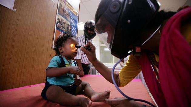 A doctor wearing a helmet examines a patient inside a ward during a nationwide doctors strike demanding security after the recent assaults on them by the patients’ relatives, in Chennai, Tamil Nadu. (P. Ravikumar / REUTERS) A doctor wearing a helmet examines a patient inside a ward during a nationwide doctors strike demanding security after the recent assaults on them by the patients’ relatives, in Chennai, Tamil Nadu. (P. Ravikumar / REUTERS)