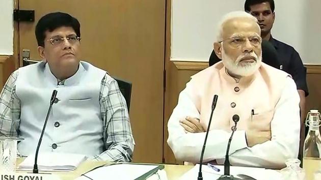 Prime Minister Narendra Modi with Union Minister Piyush Goyal attends an interactive session with over 40 economists and other experts, organized by NITI Aayog, on the theme 'Economic Policy – The Road Ahead' in New Delhi on Saturday.(ANI photo)