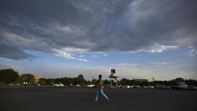 A man walks by as clouds hover over Raisina Hills, in New Delhi. (Burhaan Kinu / HT Photo) A man walks by as clouds hover over Raisina Hills, in New Delhi. (Burhaan Kinu / HT Photo)