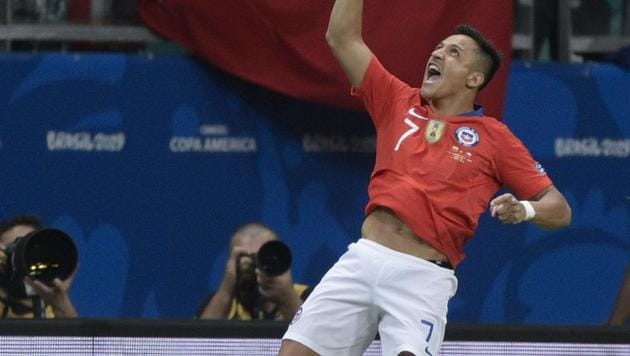 Chile's Alexis Sanchez celebrates after scoring against Ecuador during their Copa America football tournament group match at the Fonte Nova Arena in Salvador, Brazil, on June 21, 2019(AFP)